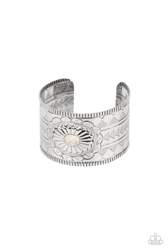 AZTEC ARTISAN BRACELET - Paparazzi - Dotted with a white stone center, a thick silver cuff is etched, stamped, and embossed in geometric tribal inspired textures.