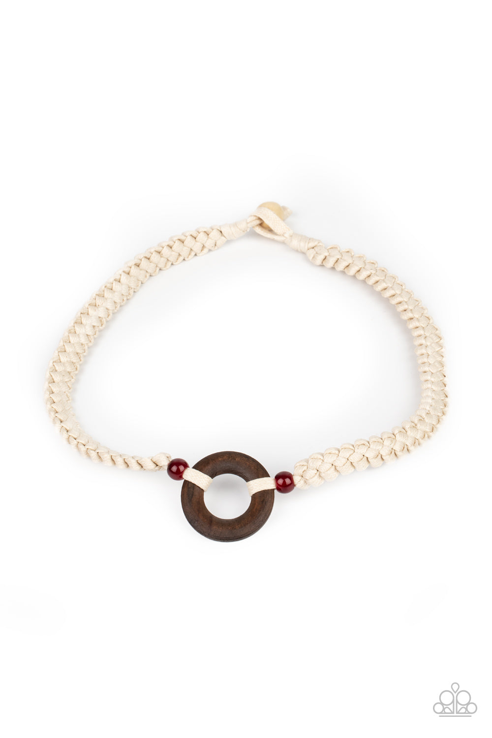 A wooden hoop is knotted in place between two glassy red beads along braided white cording around the neck for an earthy look. Features a button loop closure.