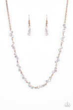 Load image into Gallery viewer, Attached to a dainty rose gold chain, trios of iridescent crystal-like beads are delicately threaded along rose gold rods below the collar for a timelessly twinkly look. Features an adjustable clasp closure.  Sold as one individual necklace. Includes one pair of matching earrings.
