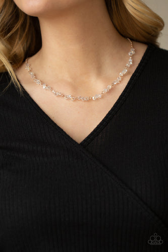 Attached to a dainty rose gold chain, trios of iridescent crystal-like beads are delicately threaded along rose gold rods below the collar for a timelessly twinkly look. Features an adjustable clasp closure.  Sold as one individual necklace. Includes one pair of matching earrings.