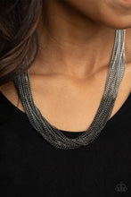 Load image into Gallery viewer, Sections of glistening gunmetal chains collide with shimmery silver chains below the collar, linking into dramatic layers for an edgy effect. Features an adjustable clasp closure.
