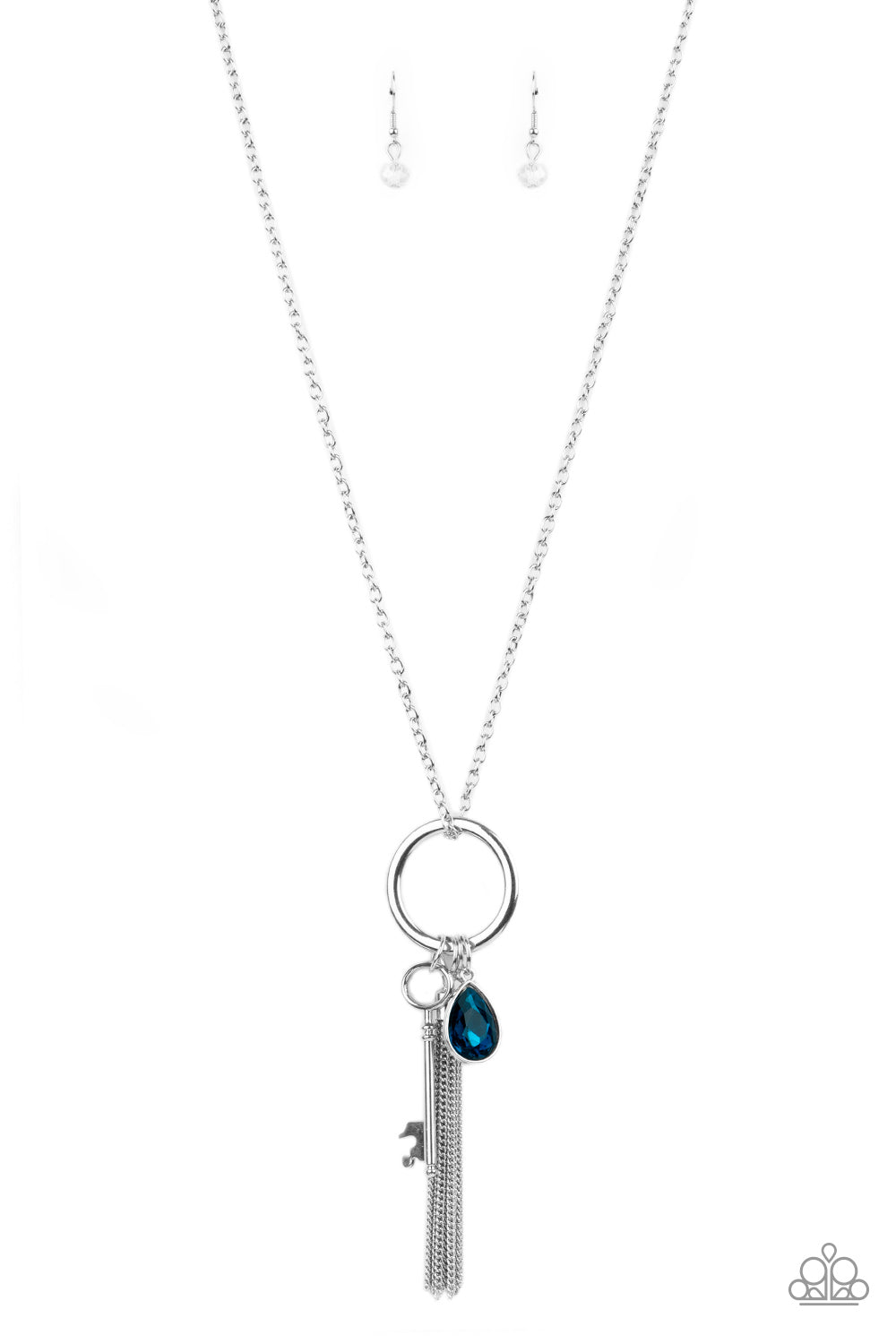 A blue teardrop gem, silver key, dainty crystal-like bead, and shimmery silver chain tassel swings from the bottom of a silver ring at the bottom of a lengthened silver chain, creating a whimsically tasseled display. Features an adjustable clasp closure.