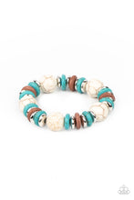 Load image into Gallery viewer, Disc shaped turquoise stones, white stones, and silvery beads join oversized white stone beads along a stretchy band, creating a rustic centerpiece around the wrist.
