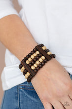 Load image into Gallery viewer, Held in place by rectangular wooden frames, strands of brown and white wooden beads are threaded along stretchy bands around the wrist for a colorfully tropical look.  Sold as one individual bracelet by Paparazzi.
