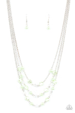 Load image into Gallery viewer, Let The Record GLOW - Green - Dainty Green Ash pearls, glassy crystal-like beads, and imperfect Green Ash pearly accents sporadically link with sections of shimmery silver chains, creating timeless layers below the collar. Features an adjustable clasp closure.
