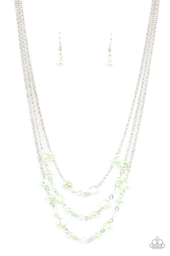 Let The Record GLOW - Green - Dainty Green Ash pearls, glassy crystal-like beads, and imperfect Green Ash pearly accents sporadically link with sections of shimmery silver chains, creating timeless layers below the collar. Features an adjustable clasp closure.