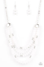 Load image into Gallery viewer, Featuring bold silver fittings, a whimsical collection of faceted white opaque crystal-like beads and dainty silver beads are threaded along invisible wires below the collar, creating icy layers. Features an adjustable clasp closure.  Sold as one individual necklace. Includes one pair of matching earrings.
