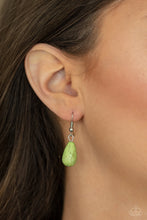Load image into Gallery viewer, Includes a free pair of matching earrings!  Paparazzi - Cowgirl Couture - Green - An Apple Green oval stone sits center stage surrounded by swirly designs stamped into a wide silver frame. A fringe of silver floral beads culminating in Apple Green stones swings like a pendulum at the end of a lengthened silver chain for a fashionable finish
