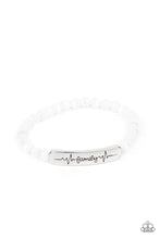 Load image into Gallery viewer, Paparazzi - Family is Forever - White - Stamped in heartbeats and the word, &quot;Family,&quot; a shiny silver plate attaches to a strand of white cat&#39;s eye stone beads that are threaded along a stretchy band, creating a whimsically sentimental centerpiece around the wrist.
