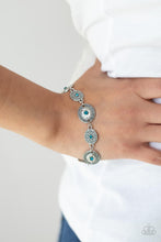 Load image into Gallery viewer, Paparazzi - SECRET GARDEN GLAMOUR - BLUE - Delicate Blue Zircon rhinestones dot the centers of engraved antiqued silver discs. The dotted textures and heart-shaped vines create a charming impression as they gracefully link around the wrist. Features an adjustable clasp closure.
