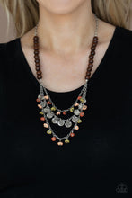 Load image into Gallery viewer, Paparazzi - Plains Paradise - Multi-Stone - Adorned with Willow, Rust, and Desert Mist pebbles and hammered silver discs, three silver chains layer from strands of brown wooden beads, creating an earthy fringe below the collar.

