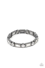 Load image into Gallery viewer, CLASSIC COUTURE - Paparazzi - Classic round and baguette-cut rhinestones set in shiny dotted gunmetal frames alternate around the wrist on stretchy bands for a shimmering finish.
