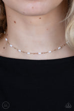Load image into Gallery viewer, Urban Expo - Gold - Paparazzi - Dainty gold beads and cylindrical white beads delicately link around the neck, creating a minimalist inspired pop of color.
