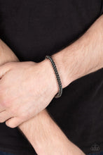 Load image into Gallery viewer, Setting The Pace - BlacK - Paparazzi - Featuring round links, a gunmetal chain is threaded along a stretchy band around the wrist for a classic urban look. UNISEX / MENS  BRACELET
