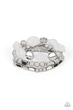 Load image into Gallery viewer, Marina Magic - Paparazzi - Infused with enchanting pops of white crystal-like and glassy accents, a mismatched assortment of hammered, cube, and faceted silver beads are threaded along stretchy bands around the wrist, creating shimmery layers.
