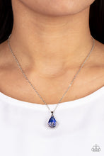 Load image into Gallery viewer, Flower Patch Fabulous - Blue - Paparazzi - Dainty silver flowers adorn the bottom of a sparkly blue teardrop gem at the bottom of a dainty silver chain, creating a prismatic pendant below the collar.
