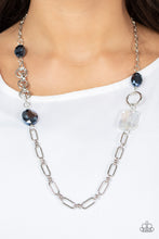 Load image into Gallery viewer, Famous and Fabulous - Blue - Paparazzi - A mismatched assortment of oval, round, textured, and silver hoops haphazardly link into a chaotic chain below the collar. Featuring oval and emerald style cuts, oversized metallic blue and iridescent gems sporadically adorn the chain for a glitzy finish.
