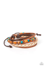 Load image into Gallery viewer, Woodsy Wayfarer - Paparazzi - An earthy combination of colorful wooden beads, shiny brown cording, a brown suede band, a brown and white braided bracelet delicately layer around the wrist for an adventurous fashion.
