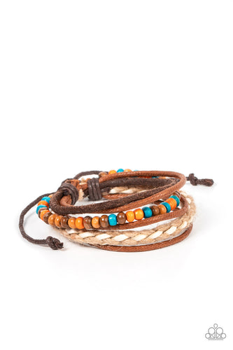 Woodsy Wayfarer - Paparazzi - An earthy combination of colorful wooden beads, shiny brown cording, a brown suede band, a brown and white braided bracelet delicately layer around the wrist for an adventurous fashion.