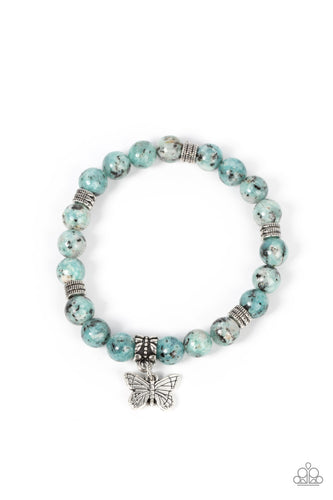 BUTTERFLY NIRVANA - BLUE - Infused with a silver butterfly charm, textured silver accents and black speckled blue stone beads are threaded along stretchy bands around the wrist for a whimsical look.