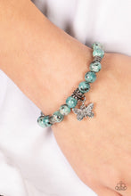 Load image into Gallery viewer, BUTTERFLY NIRVANA - BLUE - Infused with a silver butterfly charm, textured silver accents and black speckled blue stone beads are threaded along stretchy bands around the wrist for a whimsical look.
