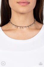 Load image into Gallery viewer, Bringing SPARKLE Back - Black - Paparazzi - Encased in gritty gunmetal fittings, glassy white rhinestones dance from the bottom of a dainty gunmetal chain for a dash of spell-binding radiance around the neck.
