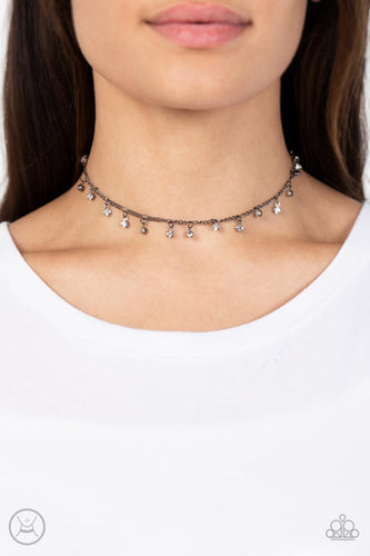 Bringing SPARKLE Back - Black - Paparazzi - Encased in gritty gunmetal fittings, glassy white rhinestones dance from the bottom of a dainty gunmetal chain for a dash of spell-binding radiance around the neck.