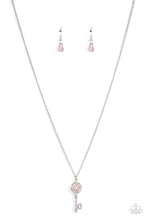 Load image into Gallery viewer, Paparazzi - Prized Key Player - Pink - Bordered in glassy white rhinestones, an opal pink rhinestone adorns a shiny silver key pendant at the bottom of a dainty silver chain for a whimsical fashion.
