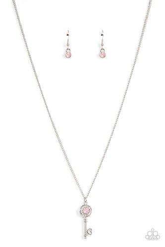 Paparazzi - Prized Key Player - Pink - Bordered in glassy white rhinestones, an opal pink rhinestone adorns a shiny silver key pendant at the bottom of a dainty silver chain for a whimsical fashion.