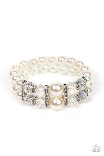 Paparazzi - Timelessly Tea Party - White - Held together by white rhinestone encrusted silver frames, a stretchy pair of bubbly pearl bracelets are infused with white rhinestone encrusted silver rings, iridescent crystal-like beads, and oversized white pearls for a timeless finish.