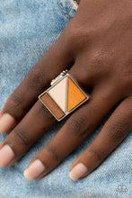 Load image into Gallery viewer, Paparazzi - Happily EVERGREEN After - Orange - Featuring natural white, orange, and brown finishes, triangular and rectangular wooden frames stack into a geometrically appealing centerpiece atop the finger.

