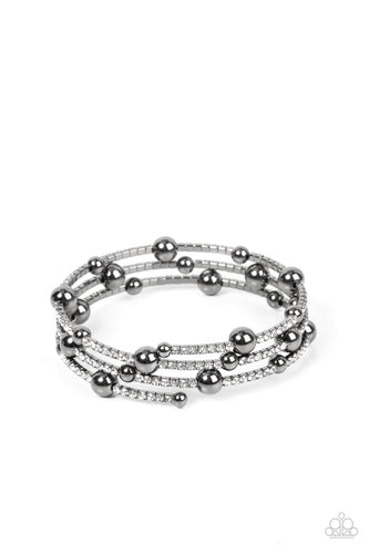 Paparazzi - Spontaneous Shimmer - Black - Spontaneously interrupted by glistening gunmetal beads, a sparkly strand of white rhinestones coils around the wrist, resulting in an irresistible infinity wrap bracelet. 
