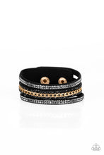 Load image into Gallery viewer, Rows of glassy hematite and black rhinestones and a shimmery gold chain are encrusted along black suede bands for a sassy look. Features an adjustable snap closure.
